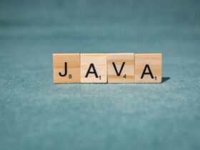 scrabble letters spelling java on teal background