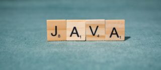 scrabble letters spelling java on teal background
