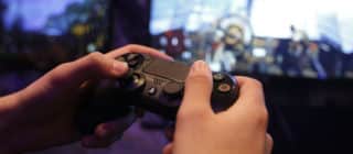 player holding a gaming console controller