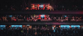 Crowd watching screens