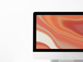 computer desktop screen on table with orange screensaver