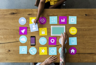Group of computer icon on the wooden table