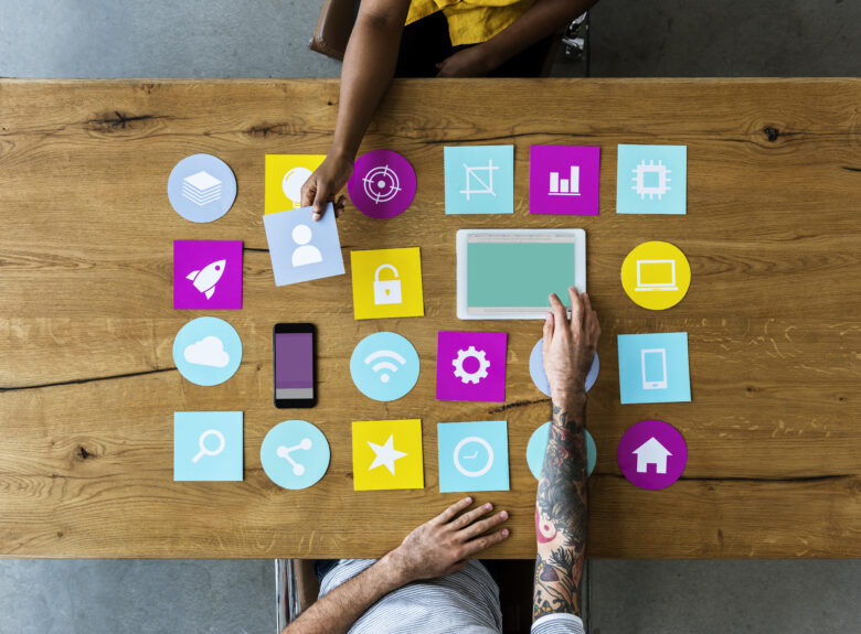 Group of computer icon on the wooden table