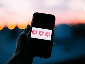 phone with comment, like, and followers buttons