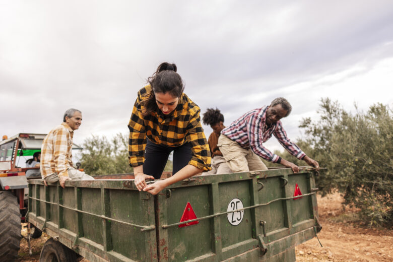 farmers in ute tray in back of truck