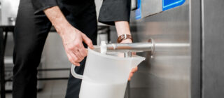 milk cooler pouring milk into jug