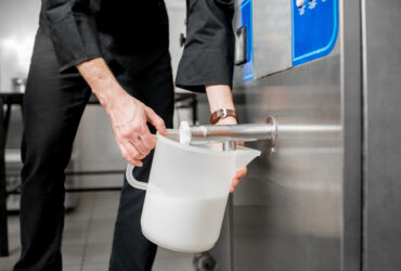 milk cooler pouring milk into jug