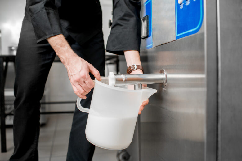 milk cooler pouring milk into jug