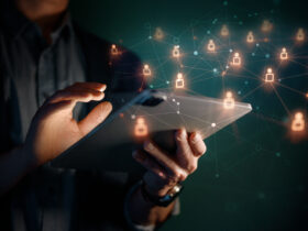 hands using tablet with holographic icons around it