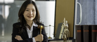 young female lawyer holding gavel