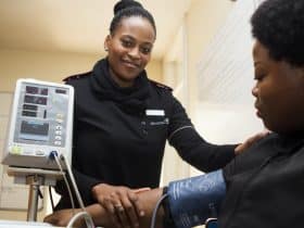 health screening nurse with patient