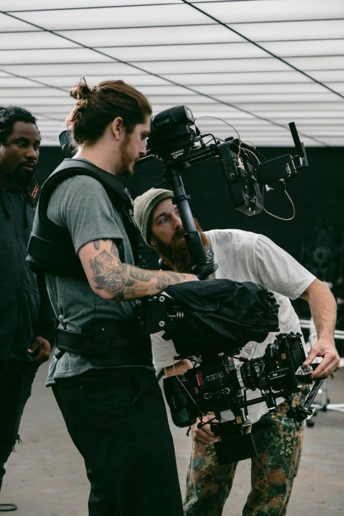camera men checking shots with a professional video recording setup