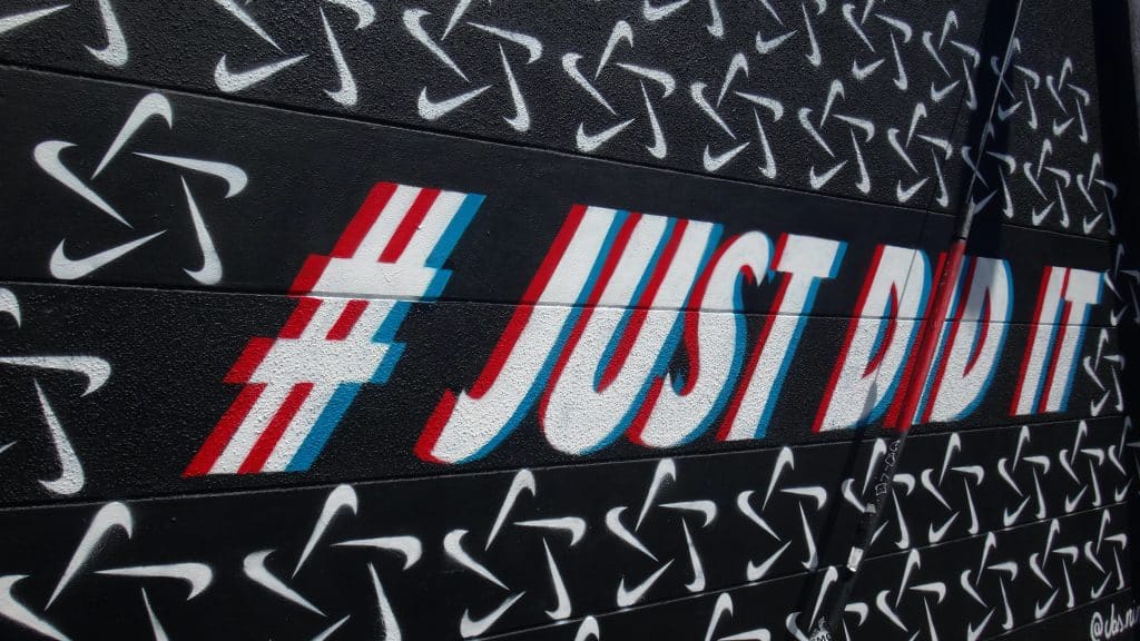 wall sign saying "Just Did It" as a hashtag