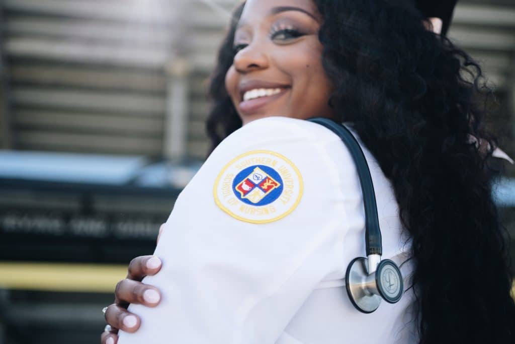 woman wearing a lab coat from the Southern University School of Nursing