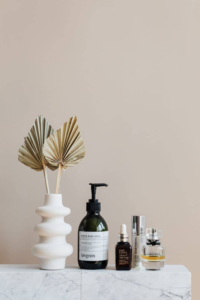 marble table with cosmetic products displayed on top