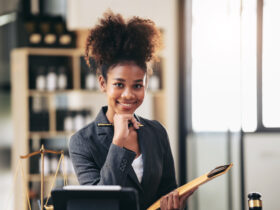 female african american lawyer holding envelope