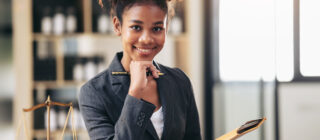 female african american lawyer holding envelope