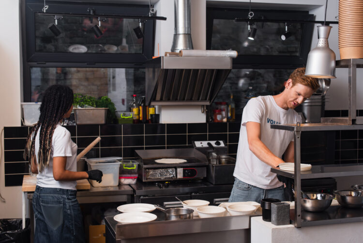 young people in tshirts cooking