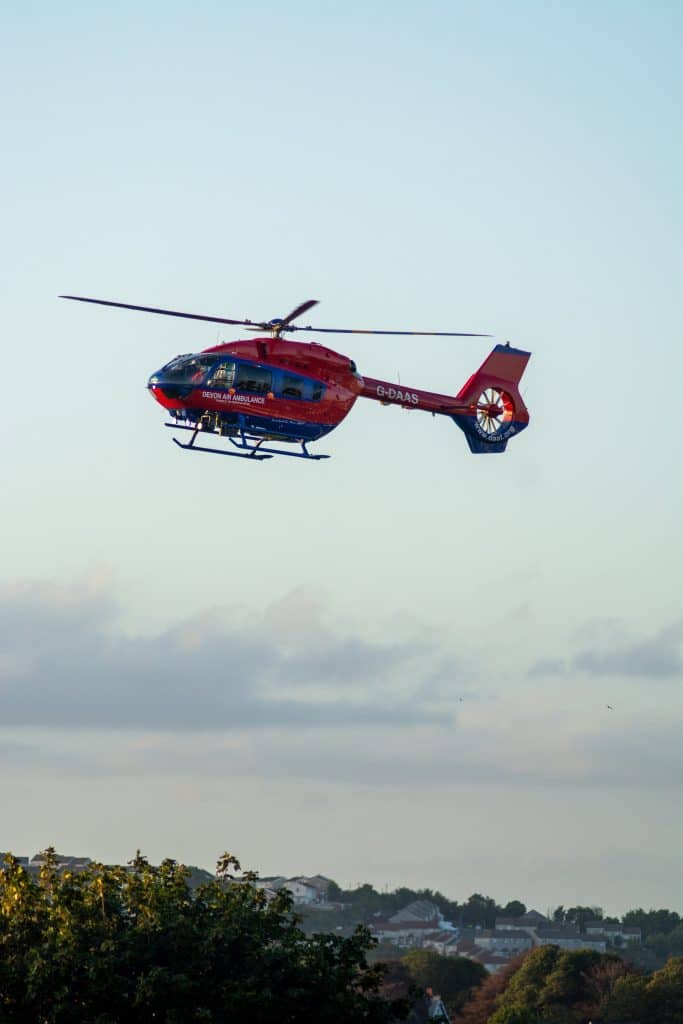 red medical emergency helicopter