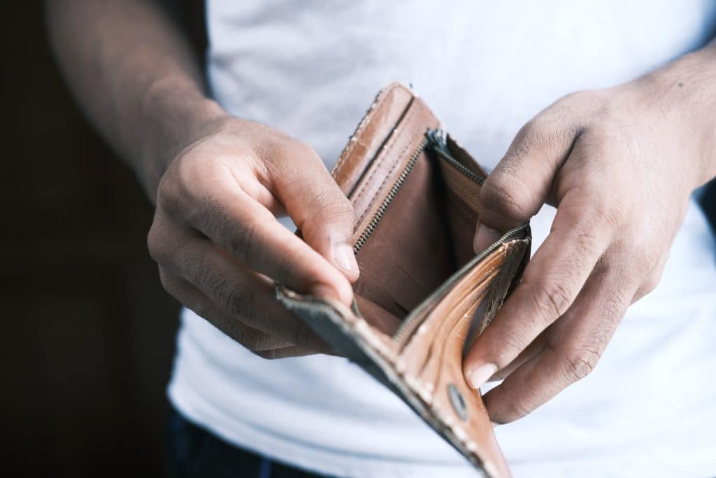 man opening an empty wallet