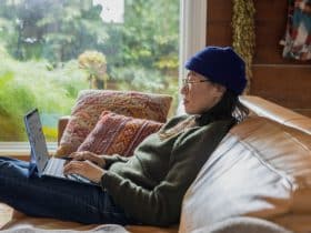 woman on couch working from home