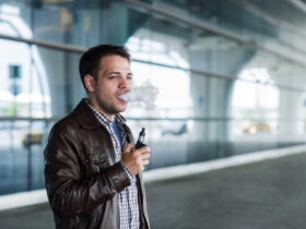 Man using e cigarette vaporizer