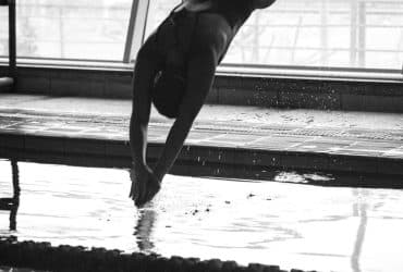 swimmer diving into pool