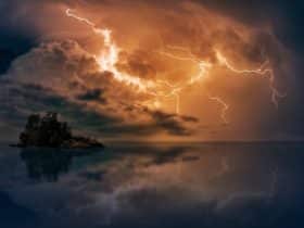 lightning over an island in open water
