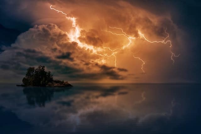 lightning over an island in open water