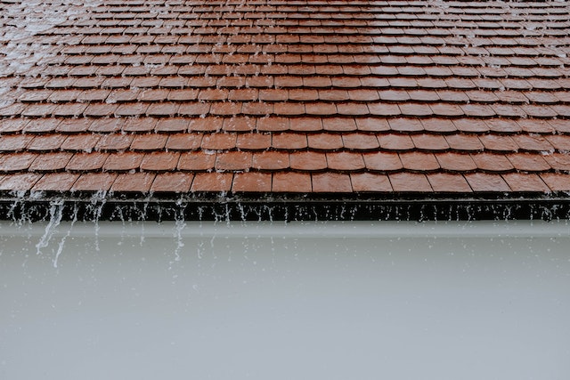 a tile roof in a rainstorm