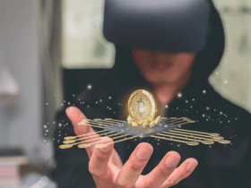 man with VR goggles looking at a bitcoin floating above his hand