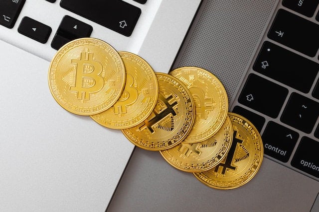bitcoins on laptop keyboard