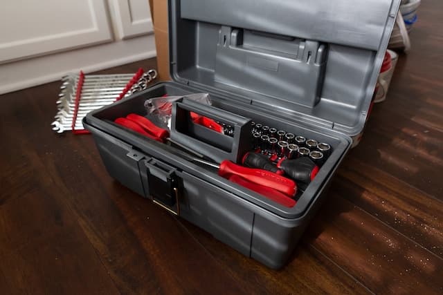 gray toolbox filled with tools