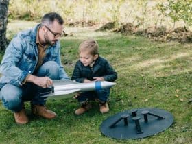 father and son working together on a model rocket