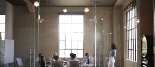 group in glass conference room