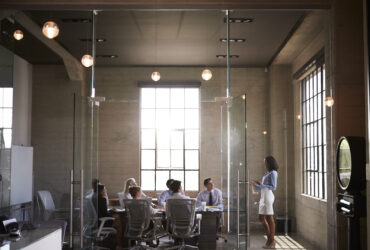 group in glass conference room