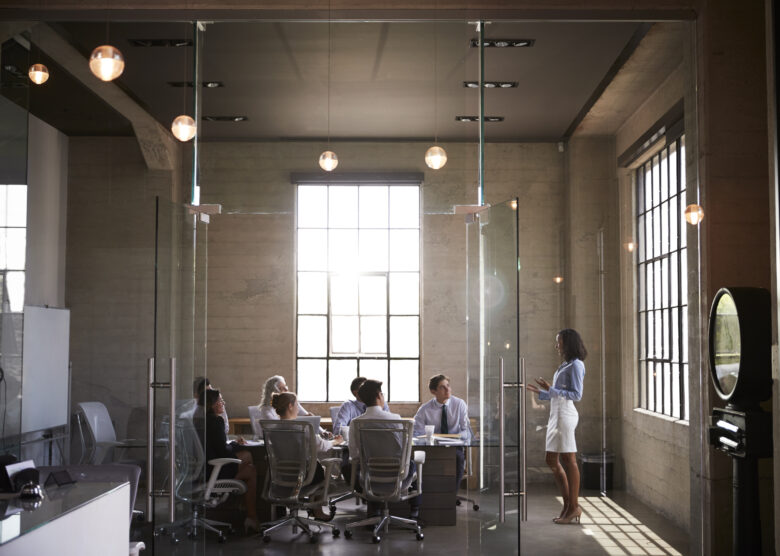 group in glass conference room