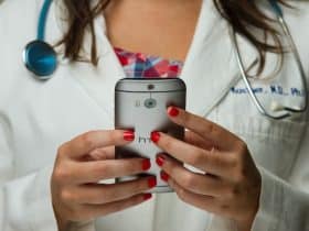 doctor or physician checking her phone