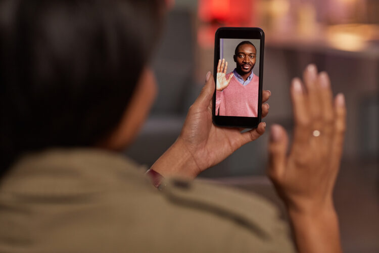 man using social media app on phone to communicate