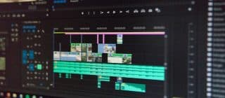 A monitor displaying a video editing project being done in Adobe Premier