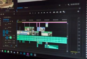 A monitor displaying a video editing project being done in Adobe Premier