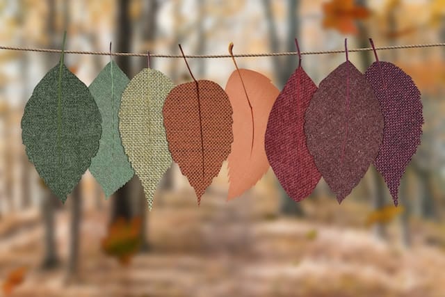 eco-friendly textiles cut into leaf shapes and hung on a clothesline