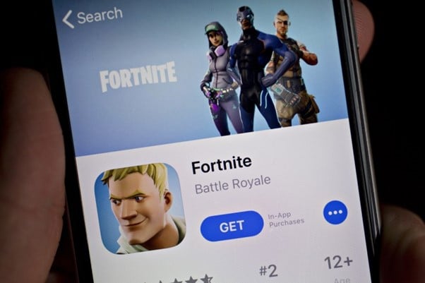 Fortnite game shown in app store on smartphone.