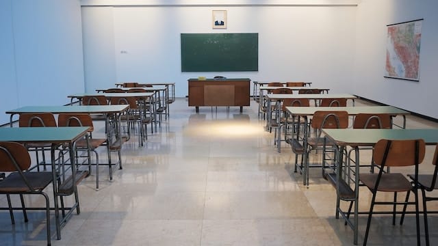 empty classroom with blackboard in front