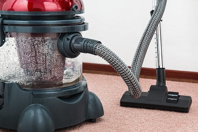 wet-dry vacuum sitting on a carpet