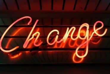 neon sign saying "change"