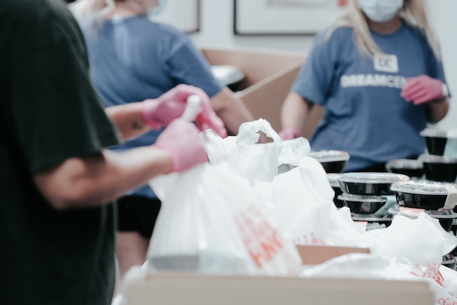 charity workers bagging food