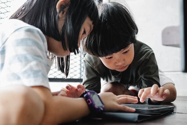 kids playing on their tablet