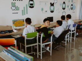 children learning on computers in school
