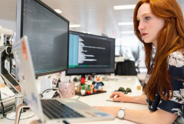 a woman working on programming code